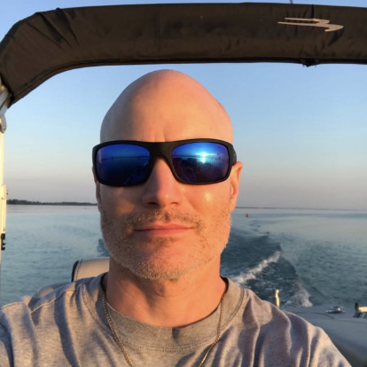 Photo of Jeremy on a boat, a Ppanish student in Paraguay